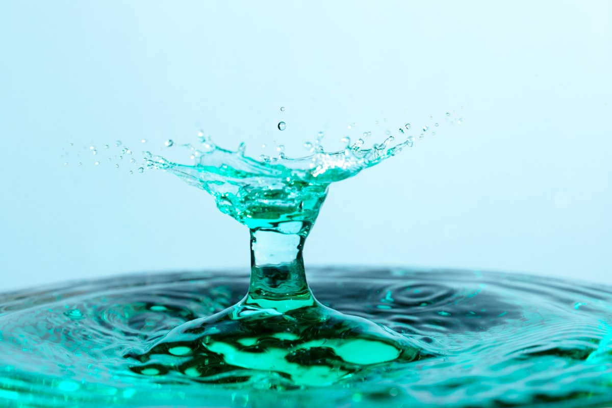 blue liquid in clear glass ph balance body skin care